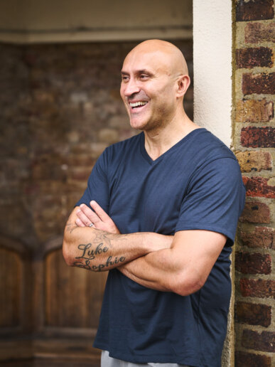 Personal trainer having his branding photoshoot outdoors in a park