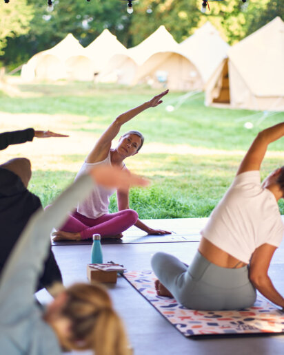 Retreat host teaching a yoga class