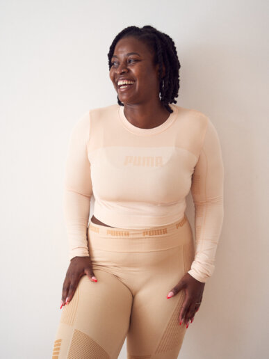 Happy Yoga instructor having her yoga branding photoshoot