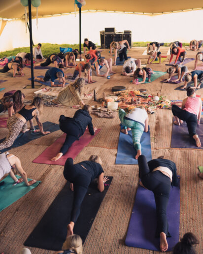 Group of people posing at a yoga festival