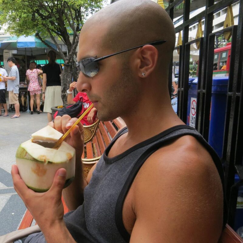 A photo from 2012 of me drinking a coconut 