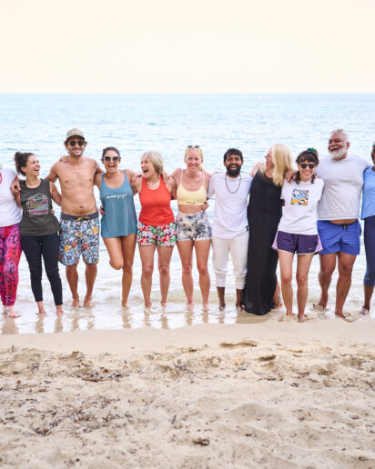 Guests from the yoga retreat on the beach