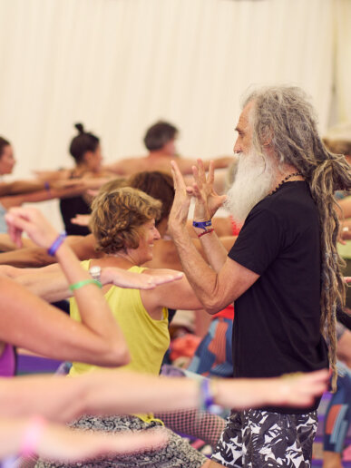 Yoga teacher and his students