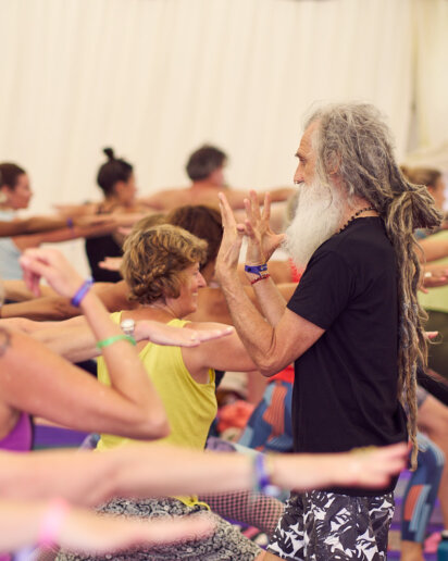 Yoga teacher and his students