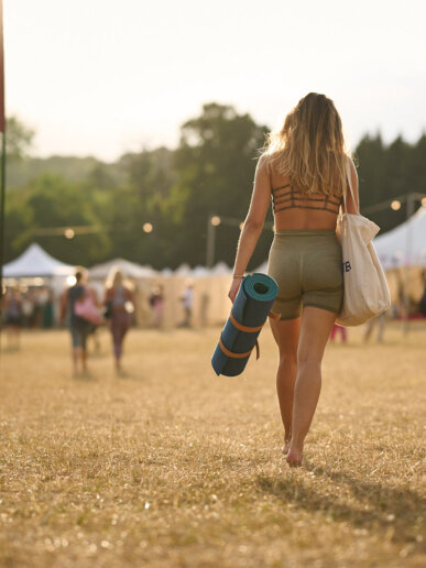 Sunset vibes at a festival, captured by a yoga photographer