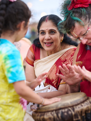 kids playing the drums at a yoga festival