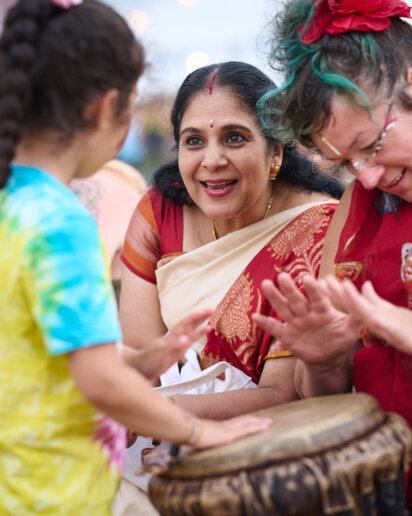 kids playing the drums at a yoga festival