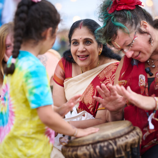 kids playing the drums at a yoga festival