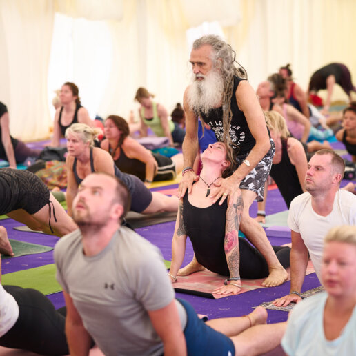 yoga teacher help posing