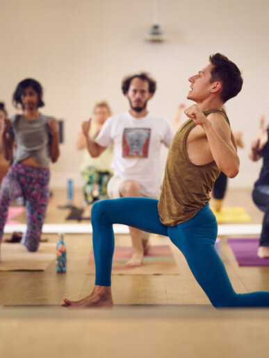 Yoga instructor leading session during a yoga workshop